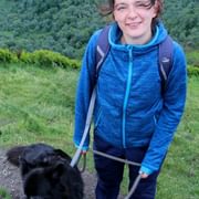 Kelly enjoying a hike with her friendly dog
